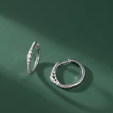 Round Graduated Solitaire Earrings